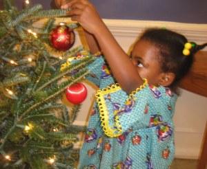     My tutee, Nacia-Pearl (4, Cameroon!) gets into the Christmas spirit at the I-tutorial program's Christmas party
